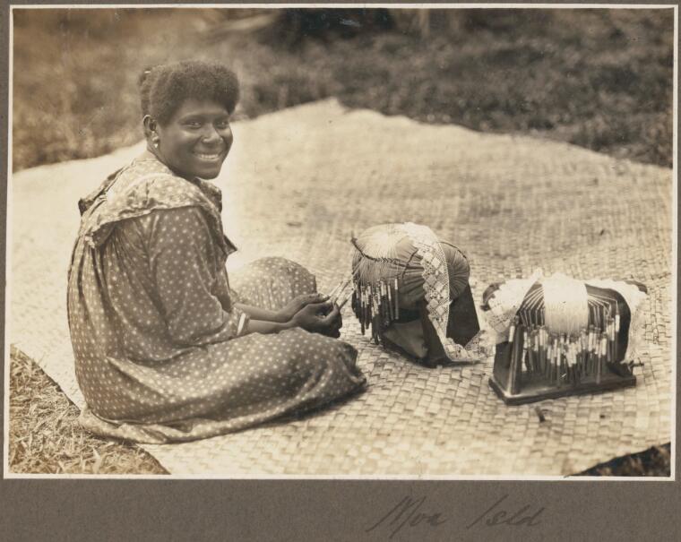 Moa Island [woman sitting on mat making lace]