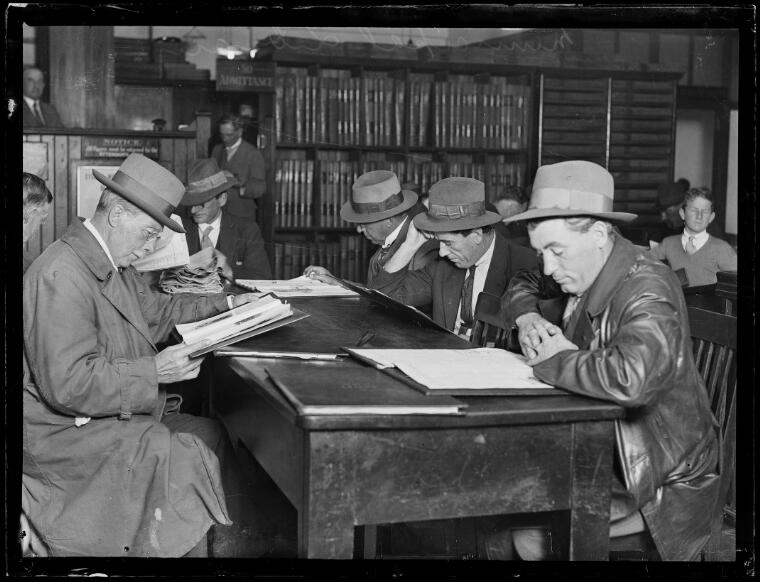 Men sitting at tables reading at the Municipal Library, New South Wales, 20 June 1930
