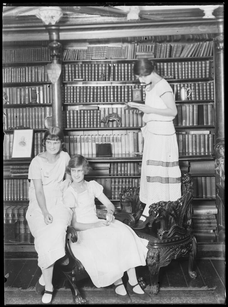 Daughters of William Coyle reading in the library, New South Wales, ca. 1920s