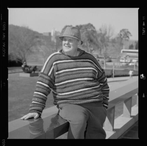 Les Murray sitting on the railing of the podium at the National Library of Australia, Canberra, 1997, 2 / Loui Seselja