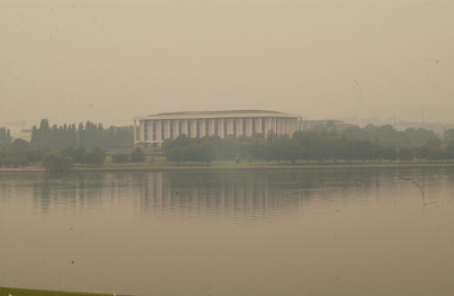 National Library looms out of the smoke haze from the Canberra bushfires, 15 January 2003 [picture] / Greg Power
