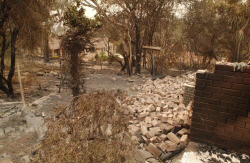 [View of a collapsed wall of a burnt house in Chapman, Canberra, January 2003] [picture] / Loui Seselja