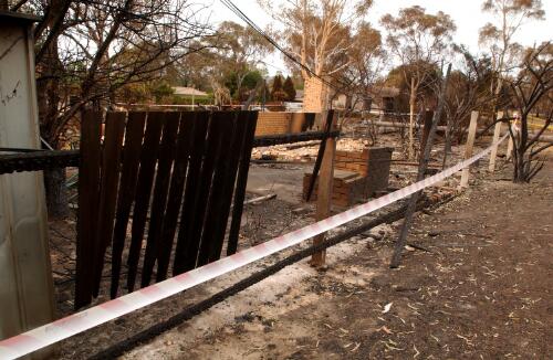 Fire damaged houses and boundary fencing, Canberra, January 2003] [picture] / Loui Seselja