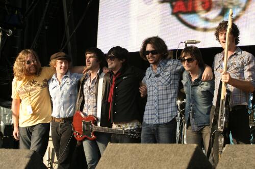 Kram, Steve Hesketh (of Jet), Davey Lane, Phil Jamieson, Bernard Fanning, Nic Cester and Pat Bourke of The Wrights, on stage at the Wave Aid relief concert for victims of the 2004 Boxing Day tsunami, Sydney Cricket Ground, 2005 [picture] / Greg Power