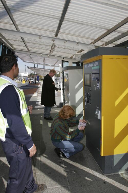 Airline customers paying for parking outside the Canberra Airport passenger terminal, 8 June 2005 [picture] / Loui Seselja