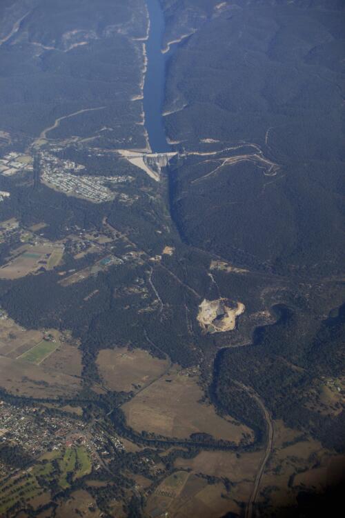 Aerial view of Warragamba Dam, New South Wales,  from Air Link Airlines' Beechcraft 1900 D, VH-RUE, Flight DR 743 from Sydney to Dubbo, 9 June 2005 [picture] / Loui Seselja