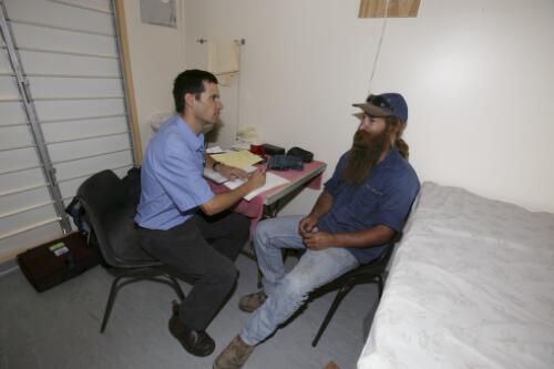 Doctor Charles Ellis with a patient at the Royal Flying Doctor Service of Australia's clinic at Einasleigh Town Hall, Queensland, 16 June 2005 [picture] / Loui Seselja