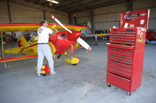 David Dent working on Pitts S1 stunt plane engine in Dent Aviation hangar at Camden Airport, 30 July 2005, [2] [picture] / Damian McDonald