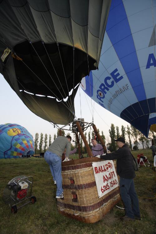 A Balloon Aloft crew member climbing into the basket of a hot air balloon, Canberra, April 2007 [picture] / Loui Seselja
