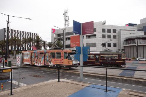 Trams at the corner of Latrobe Street and Harbour Esplanade, outside Channel 7 and Digital Harbour Port 1010, Docklands, Melbourne, May 2007 [picture] / Damian McDonald
