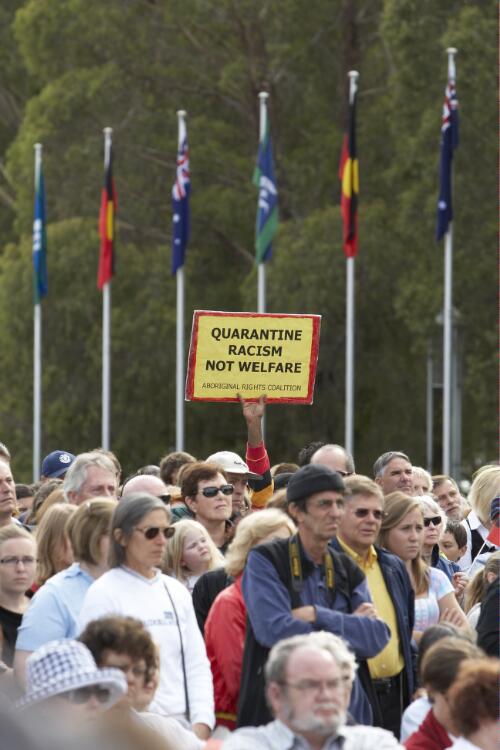 Members of the crowd with an Aboriginal Rights Coalition placard at the Apology to the Stolen Generations at Parliament House, Canberra, 13 February 2008 [picture] / Craig Mackenzie