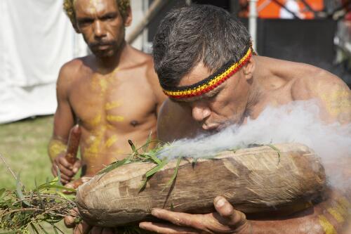 Two Aboriginal Australian men participating in a smoking ceremony to mark the Apology to the Stolen Generations at Parliament House, Canberra, 13 February 2008 [picture] / Craig Mackenzie