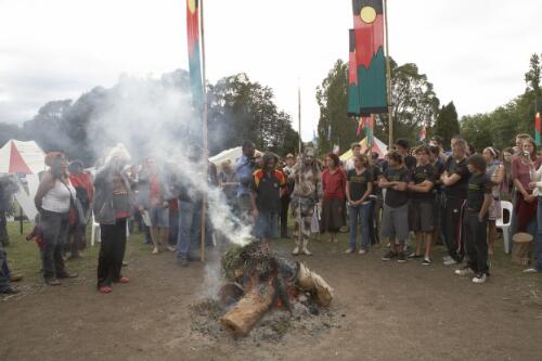 Crowd at the Aboriginal Tent Embassy gathered around the smoking ceremony to mark the Apology to the Stolen Generations, Canberra, 13 February 2008 [picture] / Damian McDonald