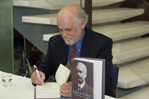 David Day signing copies of his book Andrew Fisher's biography at the National Library of Australia, 29 October 2008 [picture] / Loui Seselja