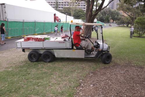 Drinks being carted outside the main entrance, The Domain, Sydney, 6 December 2008 [picture] / Greg Power