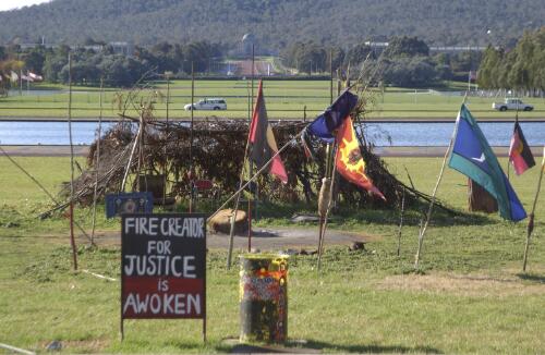 Traditional shelter and flags on the lawns, Aboriginal Tent Embassy, Canberra, 2 June 2002 / Loui Seselja