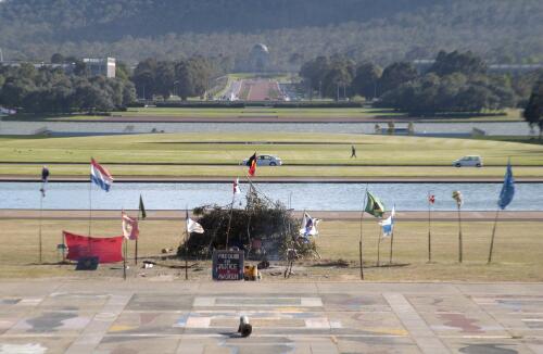 Bush structure and flags, War Memorial in background, Aboriginal Tent Embassy, Canberra, 4 November 2002 / Loui Seselja