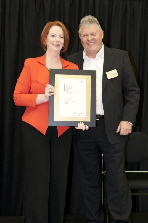 Prime Minister Julia Gillard presenting novelist Stephen Daisley with his award for winning the fiction category at the Prime Minister's Literary Awards held at the National Library of Australia, Canberra, 8 July 2011 [picture] / Sam Cooper