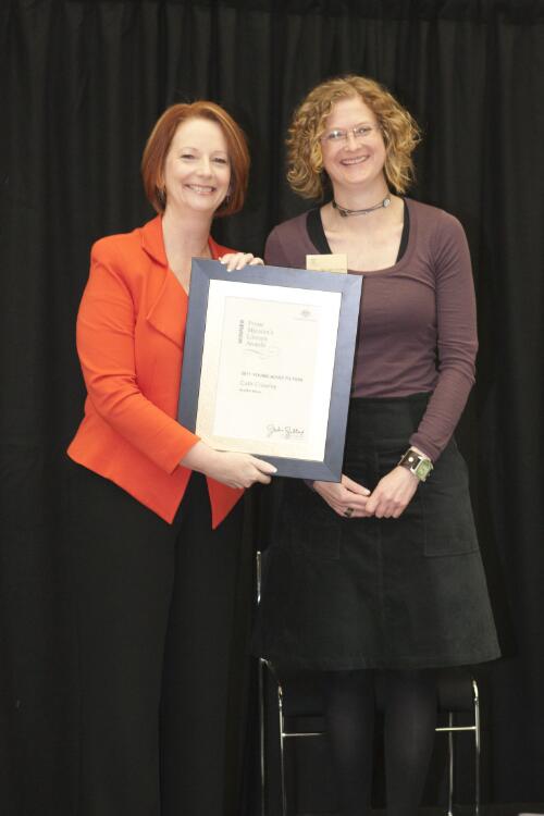 Prime Minister Julia Gillard presenting novelist Cath Crowley with her award for winning the young adult category at the Prime Minister's Literary Awards held at the National Library of Australia, Canberra, 8 July 2011 [picture] / Sam Cooper