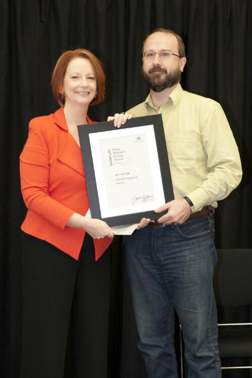 Prime Minister Julia Gillard presenting novelist David Musgrave with his award at the Prime Minister's Literary Awards held at the National Library of Australia, Canberra, 8 July 2011 [picture] / Sam Cooper