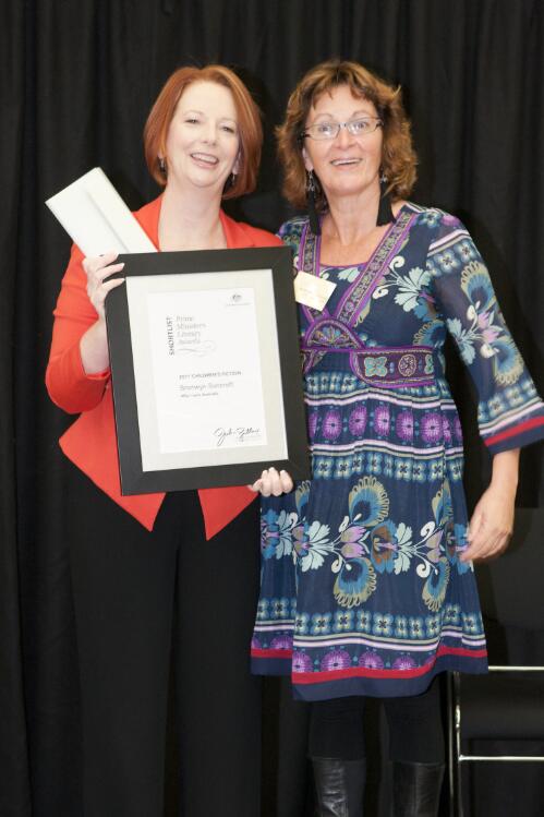 Prime Minister Julia Gillard presenting author Bronwyn Bancroft with her award at the Prime Minister's Literary Awards held at the National Library of Australia, Canberra, 8 July 2011 [picture] / Sam Cooper