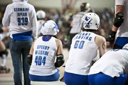 Members of the Victorian Roller Derby team Queen Bees sitting on the team bench, Melbourne Showgrounds, Melbourne 23 July 2011 [picture] / Samuel Cooper