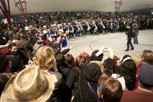The Victorian Roller Derby League All-Stars team being congratulated by the crowd as they skate a lap of the track, Melbourne Showgrounds, Melbourne 23 July 2011 [picture] / Samuel Cooper