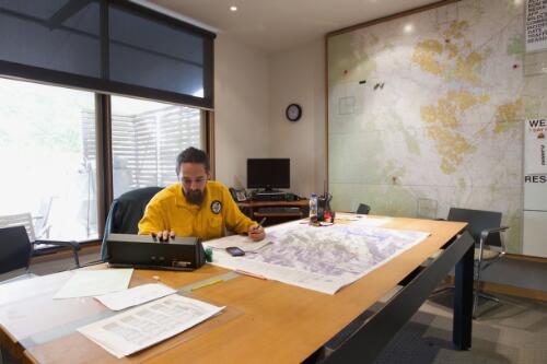 ACT Parks and Conservations officer, Brian Levine manages the Namadgi National Park controlled burn from the incident control centre located at Stromlo, Australian Capital Territory, April 2013 / Lannon Harley