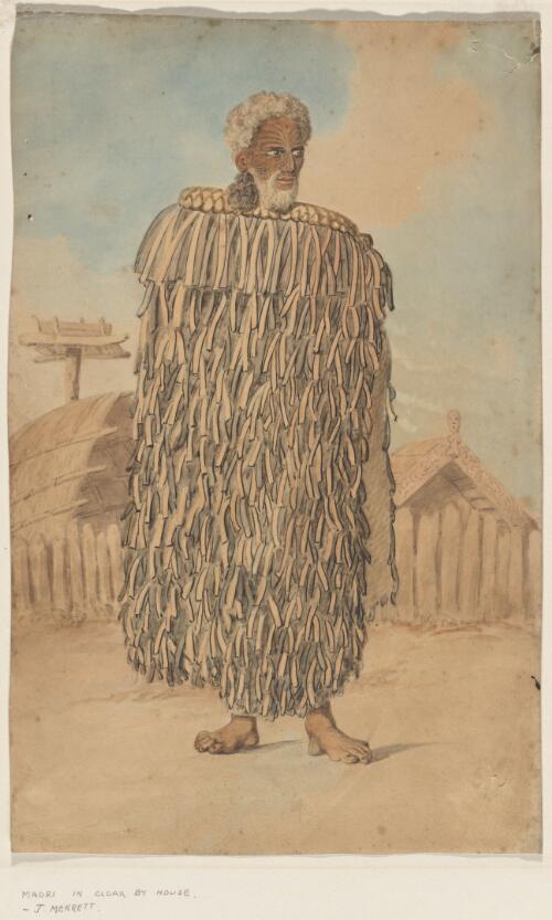 [Maori in cloak by houses] [picture] / [Joseph Jenner Merrett]
