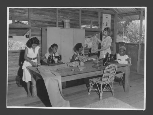 [Teacher trainees enjoy dressmaking classes at Popondetta Higher Education Centre,  New Guinea] [picture] / Australian News and Information Bureau photograph by W. Brindle