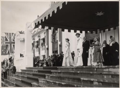 Her Majesty and His Royal Highness acknowledged the cheers of the waiting crowds from the steps of Federal Parliament House, Canberra, ... [1954] [picture] / Australian Official Photograph, Dept. of the Interior, News & Information Bureau