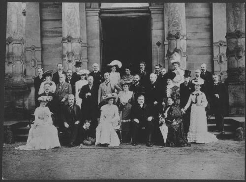 [Sir Edmund Barton seated with a group of people outside a columned building, 1902] [picture] / Australian News & Information Bureau