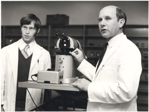 Professor Barter instructs a student in gynaecological cytology with the aid of a micro-projector at his laboratories in Perth, Western Australia [picture] / Australian Information Service photograph by Mike Brown