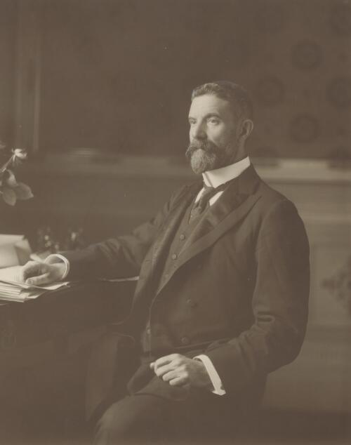 [Portrait of Alfred Deakin seated at his desk] [picture] / Elliott & Fry