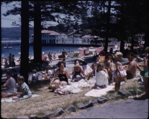[People under the pines at Manly, New South Wales, 2] [transparency] / [Frank Hurley]