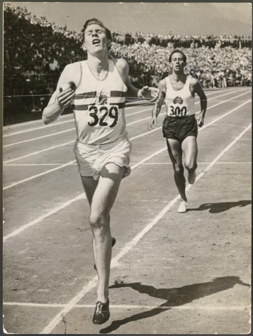 Britain's Roger Bannister breasts the tape to win the mile at the Empire Games, Vancouver, 7 August 1954, in 3 minutes 58.8 seconds with Australia's John Landy about three yards behind to finish second in 3 minutes 59.6 seconds [picture] / Associated Press