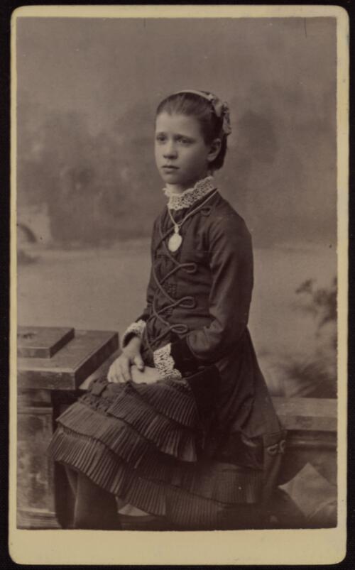 [Portrait of a girl wearing a dress with lace collar and cuffs, Orange, New South Wales, ca. 1883] [picture] / Hutchison & Spliet
