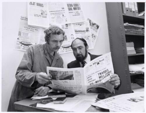 Maltese Herald editor Mr Lino Vella (right), with one of his printing staff, checks a machine proof ... 1975 [picture] / John Tanner