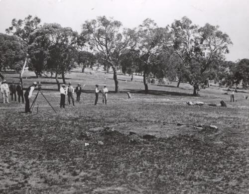 Sir George Fuller taking the first sight in the preliminary contour survey, Camp Hill, Australian Capital Territory, 1909 [picture] / Mr. Piggin