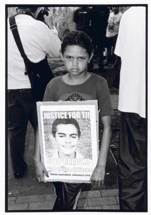 Young girl holding a placard at a march to protest the death of T.J. Hickey, Redfern, New South Wales, 2004 [picture] / Louise Whelan