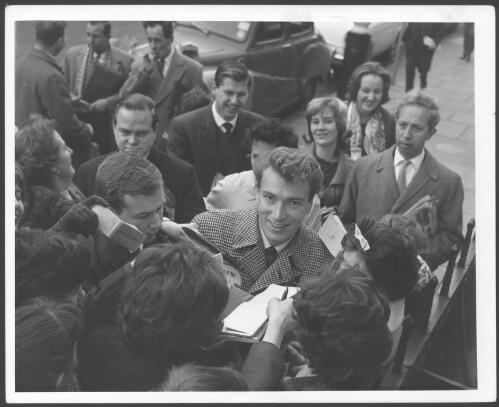 [Frank Ifield with autograph seekers, 1962] [picture]