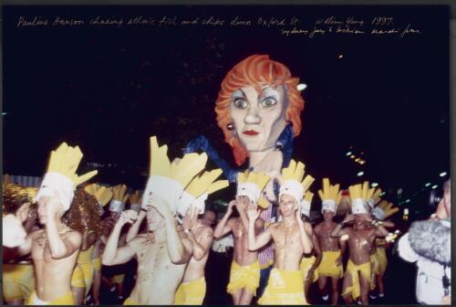 Pauline Hanson chasing ethnic fish and chips down Oxford St [i.e. Street], Sydney Gay & Lesbian Mardi Gras, 1997 [picture] / William Yang