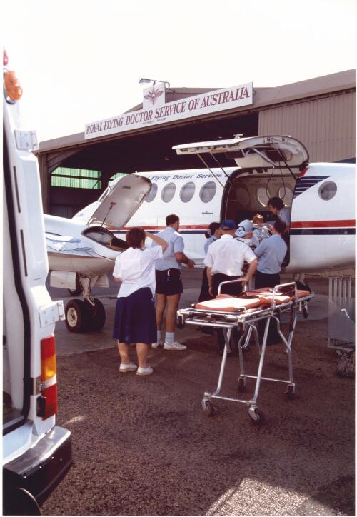 [Loading patient into Royal Flying Doctor Service of Australia Victorian Section airplane, 1993] [picture] / Richard Woldendorp