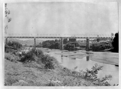 [Tharwa Bridge with two unidentified men standing on left riverbank, Australian Capital Territory] [picture]