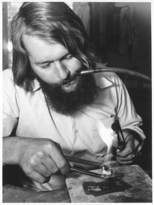 Ray Norman, craftsman jeweller, at Sturt Workshops, Mittagong, [New South Wales], 1971 [picture] / Australian Information Service photograph by Alex Ozolins