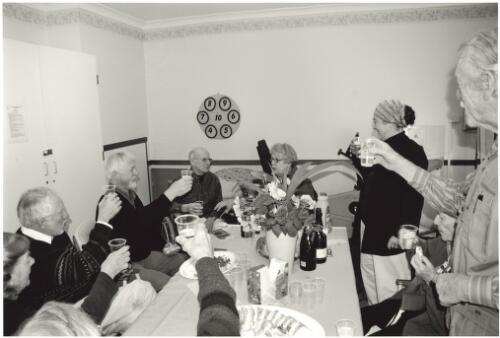 Members of Pens & Pencils, including Peter Pinson, Lou Klepac, Doreen (Gadsby) Coburn, Margaret Woodward and Guy Warren raise their plastic cups of champagne to toast John Coburn, 2004 [picture] / Barbara Konkolowicz