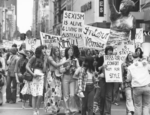Women on the march wave their placards at the International Women's Day march, Melbourne, March 8, 1975 [picture] / Australian Information Service photograph by John McKinnon