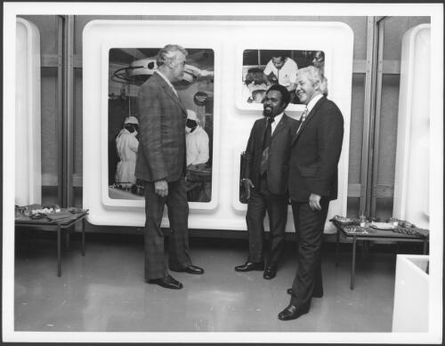 At the opening of the Papua New Guinea display at the National Library in Canberra, the Chief Minister Mr Michael Somare (centre) discussed the exhibition with the Australian Prime Minister Mr [Edward] Gough Whitlam (left) and the Minister for External Territories, Mr W. L. Morrison (right) [picture] / Australian Information Service photograph by Norman Plant
