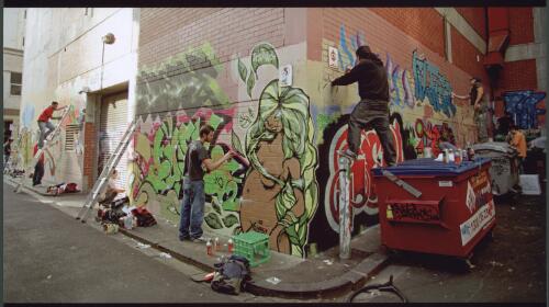 Artists at work in a back street [picture] / Dave Tacon