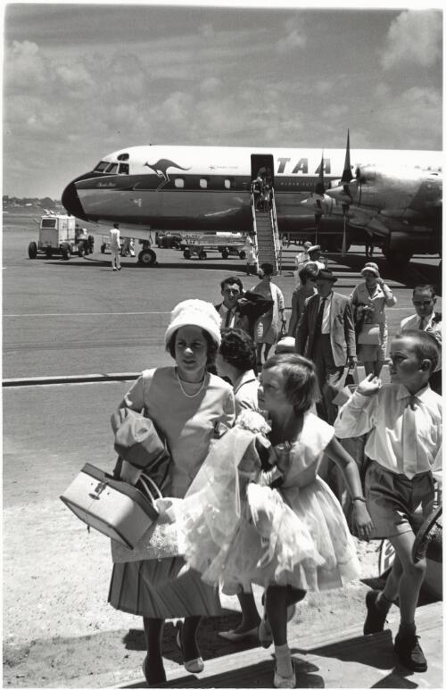 Mascot arrivals, disembarking from a TAA airplane, 1961 [picture] / Jeff Carter